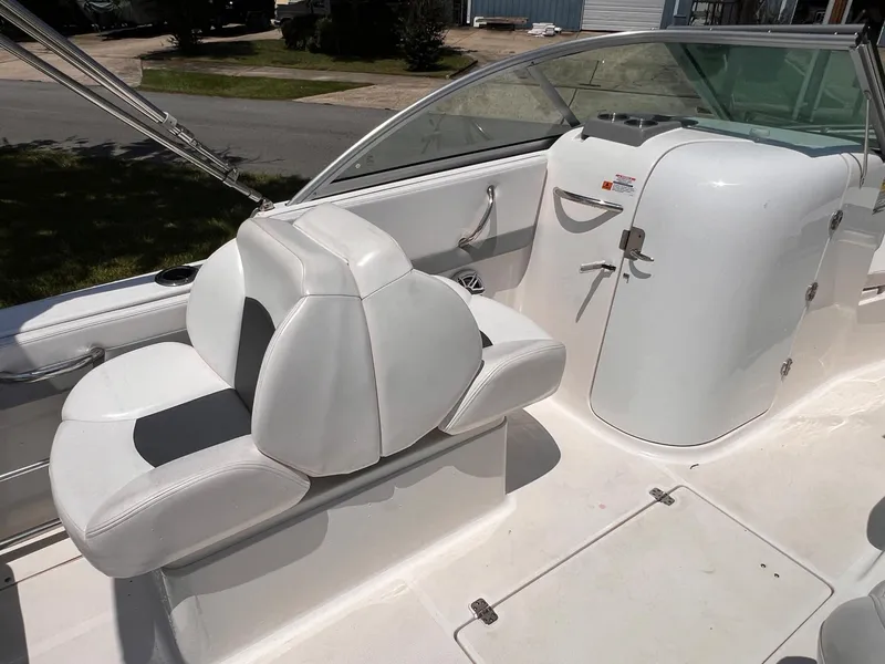 Slide: The Image of 2021 Robalo R227 Dual Console boat interior with white seating and console. - 11