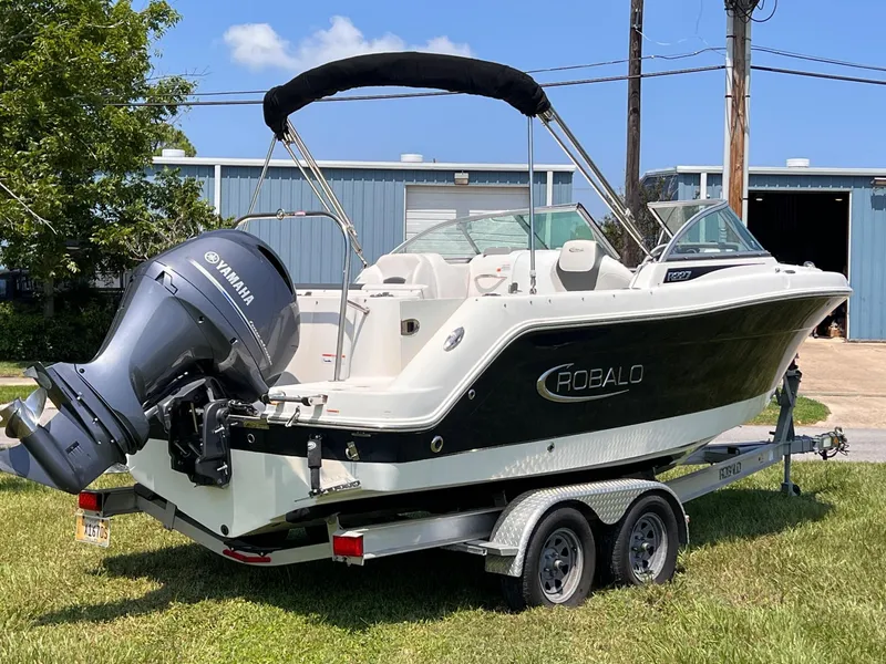 Slide: The Image of 2021 Robalo R227 Dual Console boat on trailer with Yamaha outboard motor. - 4