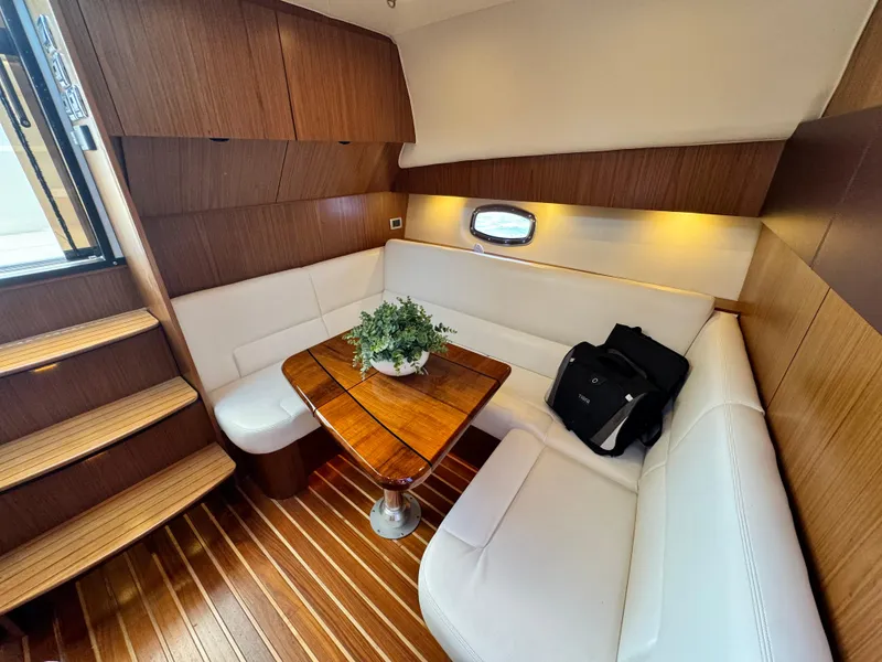 Slide: The Image of Luxurious interior of 2019 Tiara Yachts 4300 Open with elegant seating and wooden accents. - 24