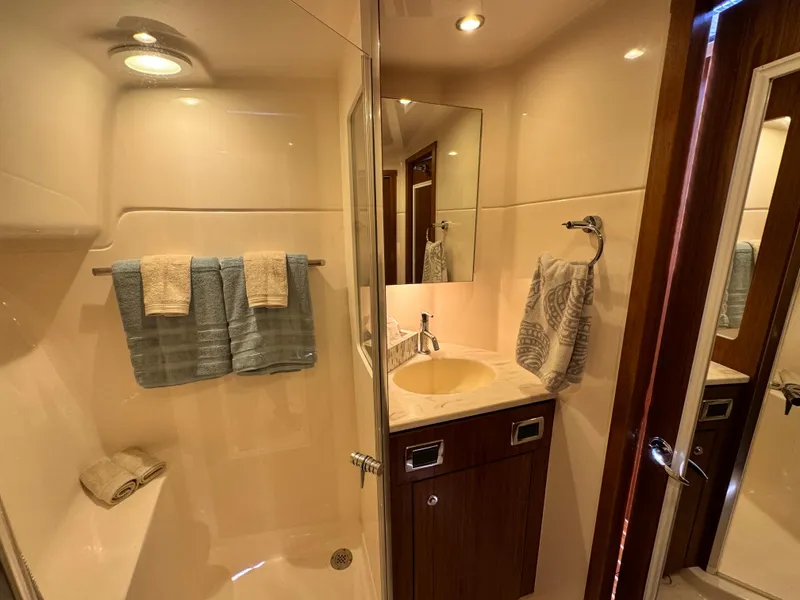 Slide: The Image of Luxurious bathroom in 2019 Tiara Yachts 4300 Open, featuring modern fixtures and elegant design. - 30