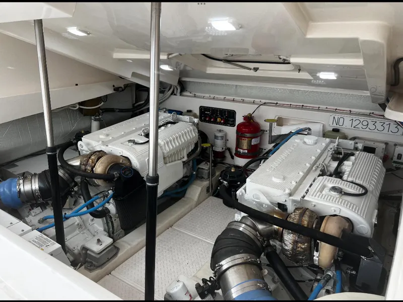 Slide: The Image of Engine room of 2019 Tiara Yachts 4300 Open with dual engines and safety equipment. - 32