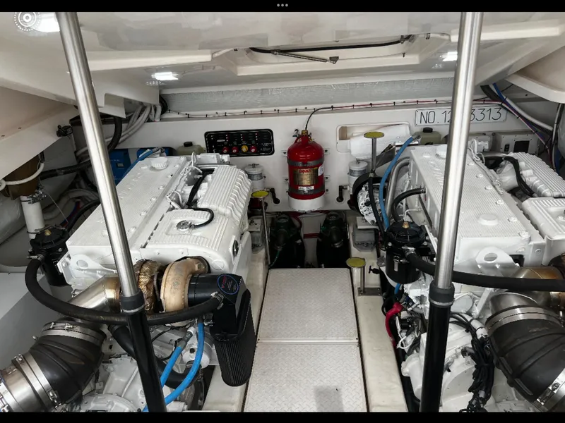 Slide: The Image of Engine room of 2019 Tiara Yachts 4300 Open, featuring dual engines and safety equipment. - 33
