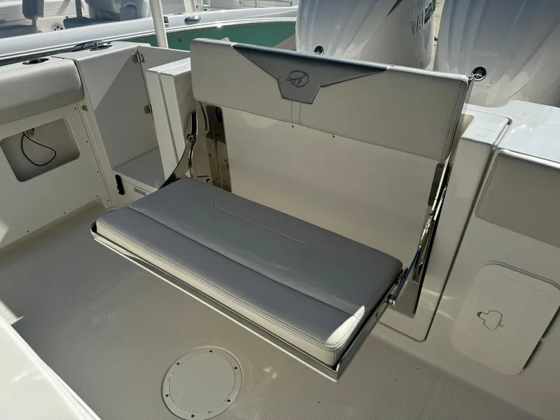 Slide: The Image of 2025 Sailfish 272 CC boat interior with foldable seating and storage compartments. - 10