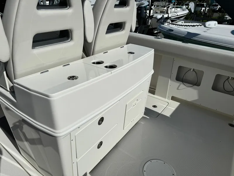 Slide: The Image of 2025 Sailfish 272 CC boat interior with seating and storage compartments. - 13