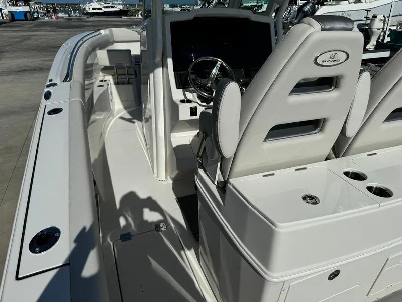 Slide: The Image of 2025 Sailfish 272 CC boat interior with helm and seating area. - 14
