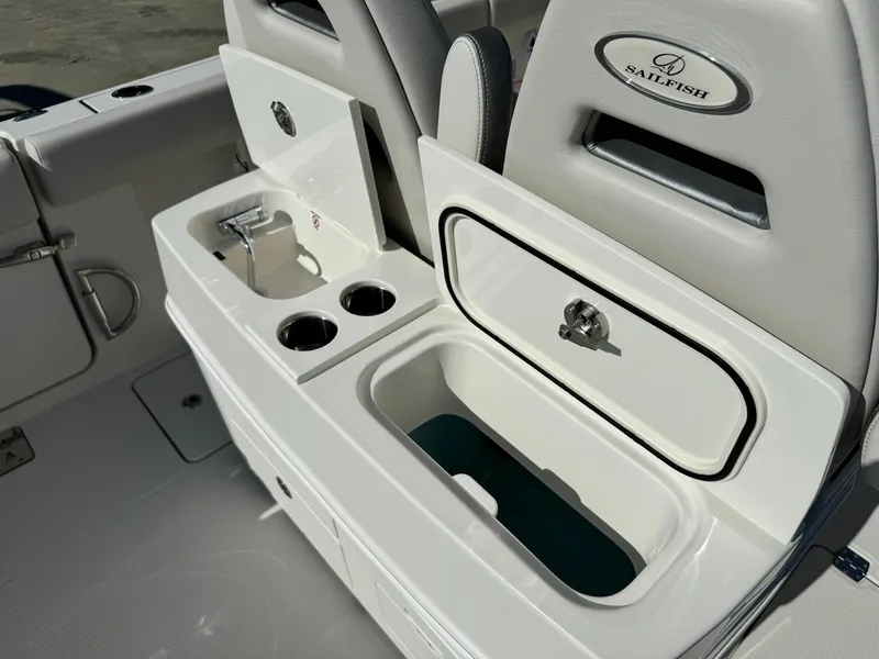Slide: The Image of 2025 Sailfish 272 CC boat interior with storage compartments and cup holders. - 15