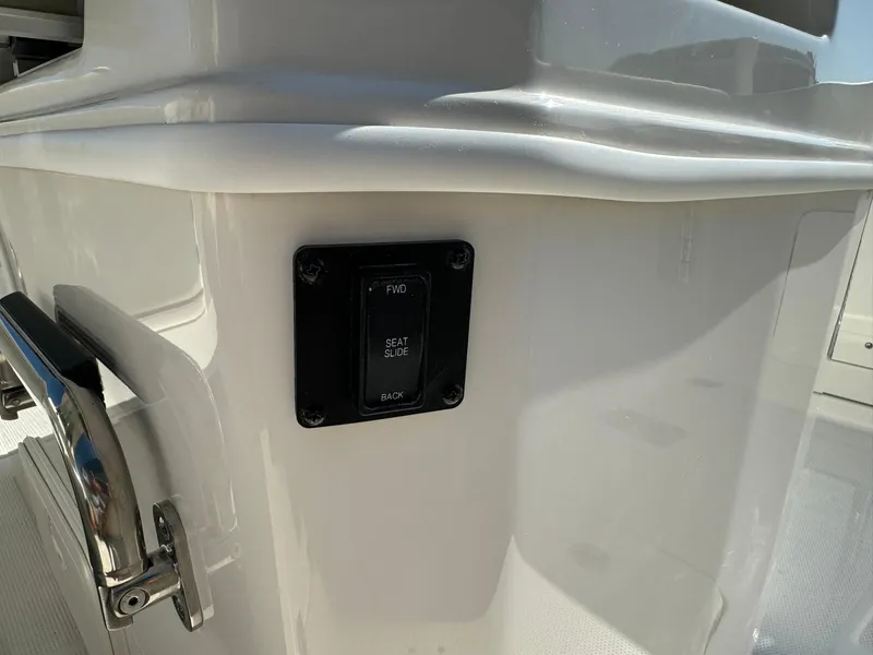 Slide: The Image of 2025 Sailfish 272 CC boat seat adjustment control panel. - 19