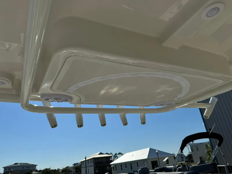 Slide: The Image of 2025 Sailfish 272 CC boat roof with rod holders and speaker system. - 23