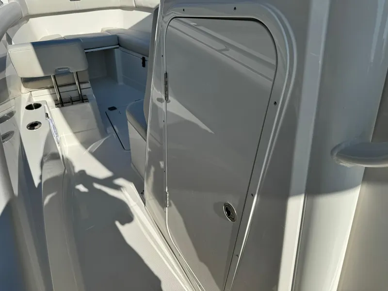 Slide: The Image of 2025 Sailfish 272 CC boat interior with seating and storage compartment. - 26