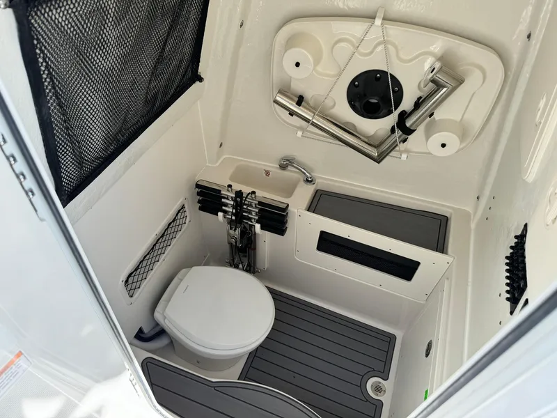 Slide: The Image of 2025 Sailfish 272 CC boat interior with compact bathroom and modern amenities. - 28