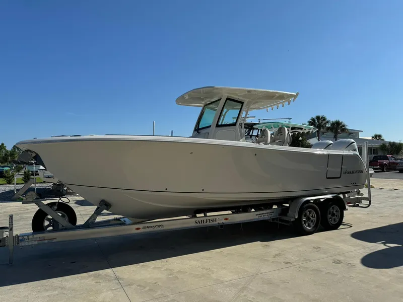 Slide: The Image of 2025 Sailfish 272 CC boat on trailer under clear blue sky. - 3