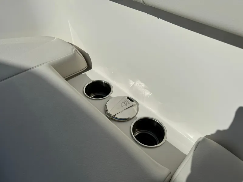 Slide: The Image of Sailfish 272 CC 2025 boat interior with cup holders and seating. - 30