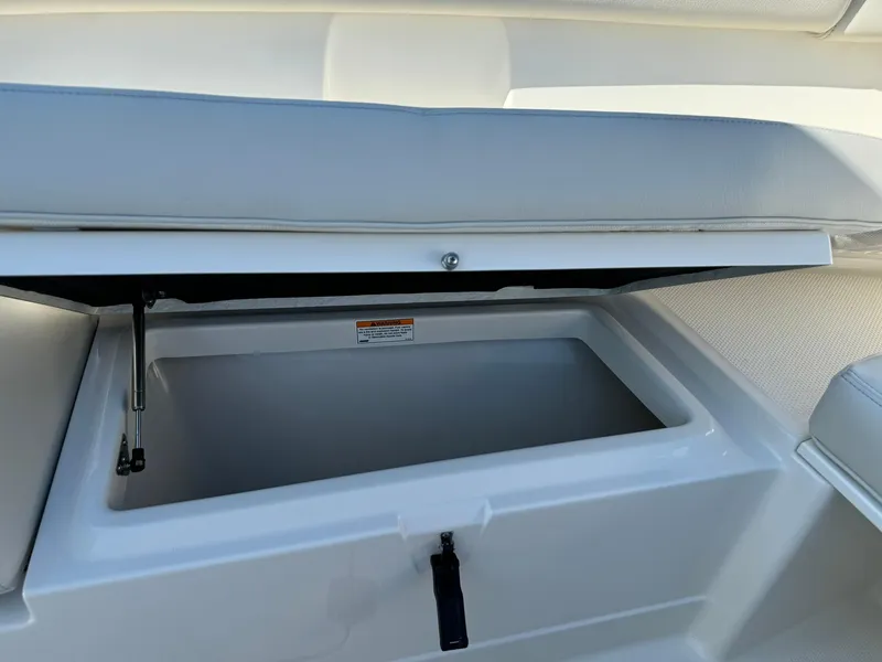Slide: The Image of Open storage compartment on 2025 Sailfish 272 CC boat. - 33