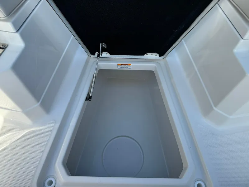 Slide: The Image of 2025 Sailfish 272 CC storage compartment, open lid, spacious interior. - 34