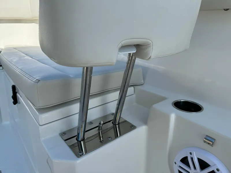Slide: The Image of 2025 Sailfish 272 CC boat interior with cushioned seating and stainless steel fixtures. - 36