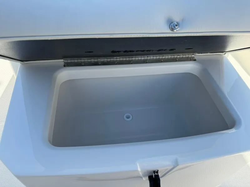 Slide: The Image of Open storage compartment on 2025 Sailfish 272 CC boat. - 37