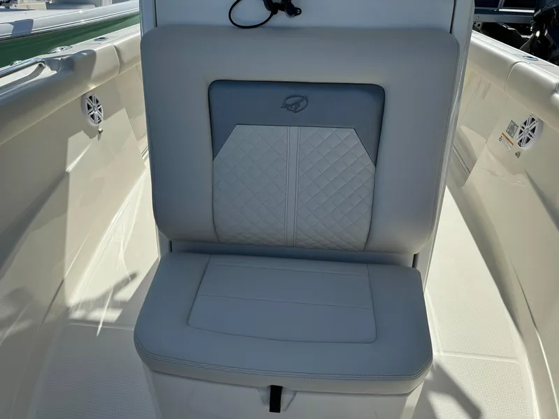 Slide: The Image of 2025 Sailfish 272 CC boat seat with quilted design and sleek white interior. - 38