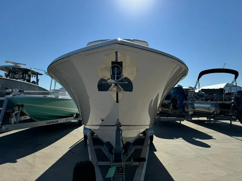 Slide: The Image of 2025 Sailfish 272 CC boat on trailer under clear blue sky. - 4