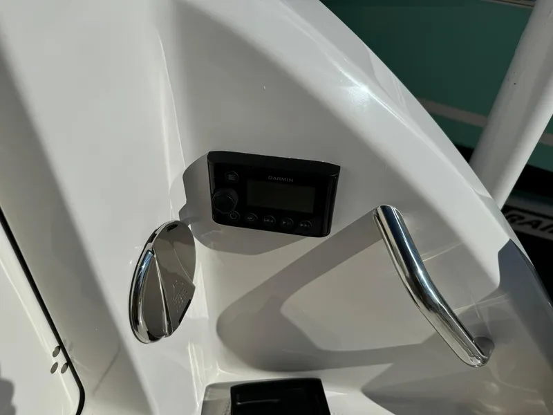 Slide: The Image of Close-up of 2025 Sailfish 272 CC boat dashboard with control panel and handle. - 41