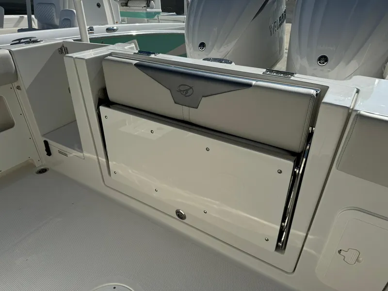 Slide: The Image of 2025 Sailfish 272 CC boat interior with foldable seat and dual engines. - 9