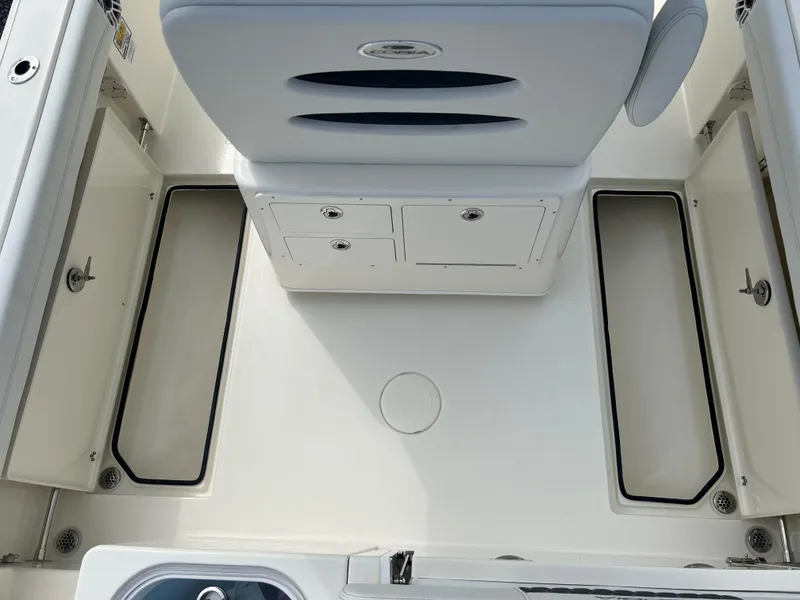Slide: The Image of 2025 Cobia 240 Center Console boat interior with storage compartments and seating. - 13