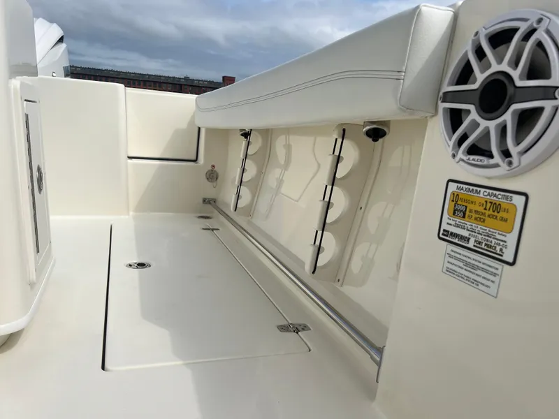 Slide: The Image of 2025 Cobia 240 Center Console boat interior with seating and speaker. - 15