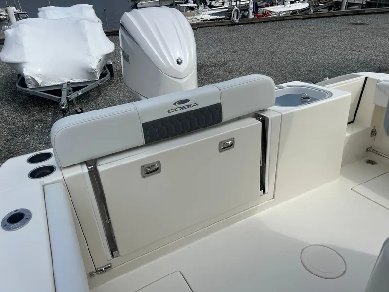 Slide: The Image of 2025 Cobia 240 Center Console boat interior with seating and storage. - 16