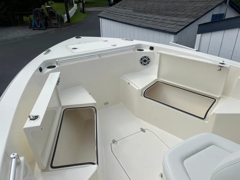 Slide: The Image of 2025 Cobia 240 Center Console boat interior with spacious seating and storage compartments. - 31