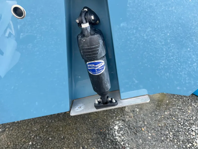 Slide: The Image of Bennett trim tab on 2025 Cobia 240 Center Console boat. - 6