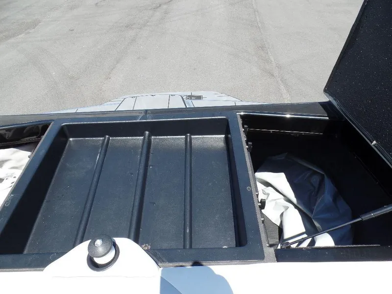 Slide: The Image of 2019 Axis A24 boat storage compartments with open lids. - 12