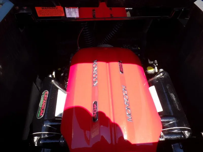 Slide: The Image of 2019 Axis A24 engine with red cover, featuring Monsoon branding. - 15