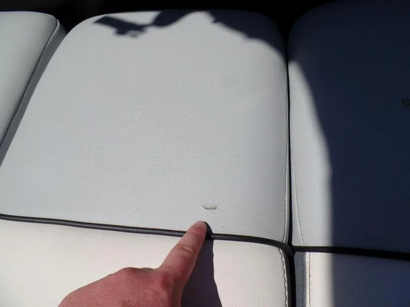Slide: The Image of Close-up of a 2019 Axis A24 boat seat with a small tear. - 18