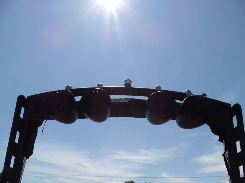 Slide: The Image of Axis A24 2019 boat tower speakers under bright sun and clear blue sky. - 6