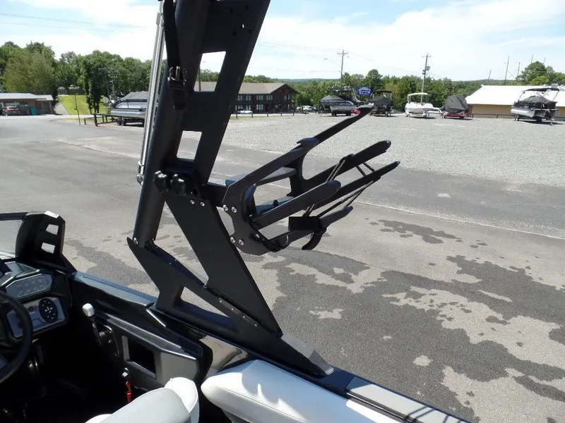 Slide: The Image of 2019 Axis A24 boat with wakeboard tower and rack in a parking lot. - 8