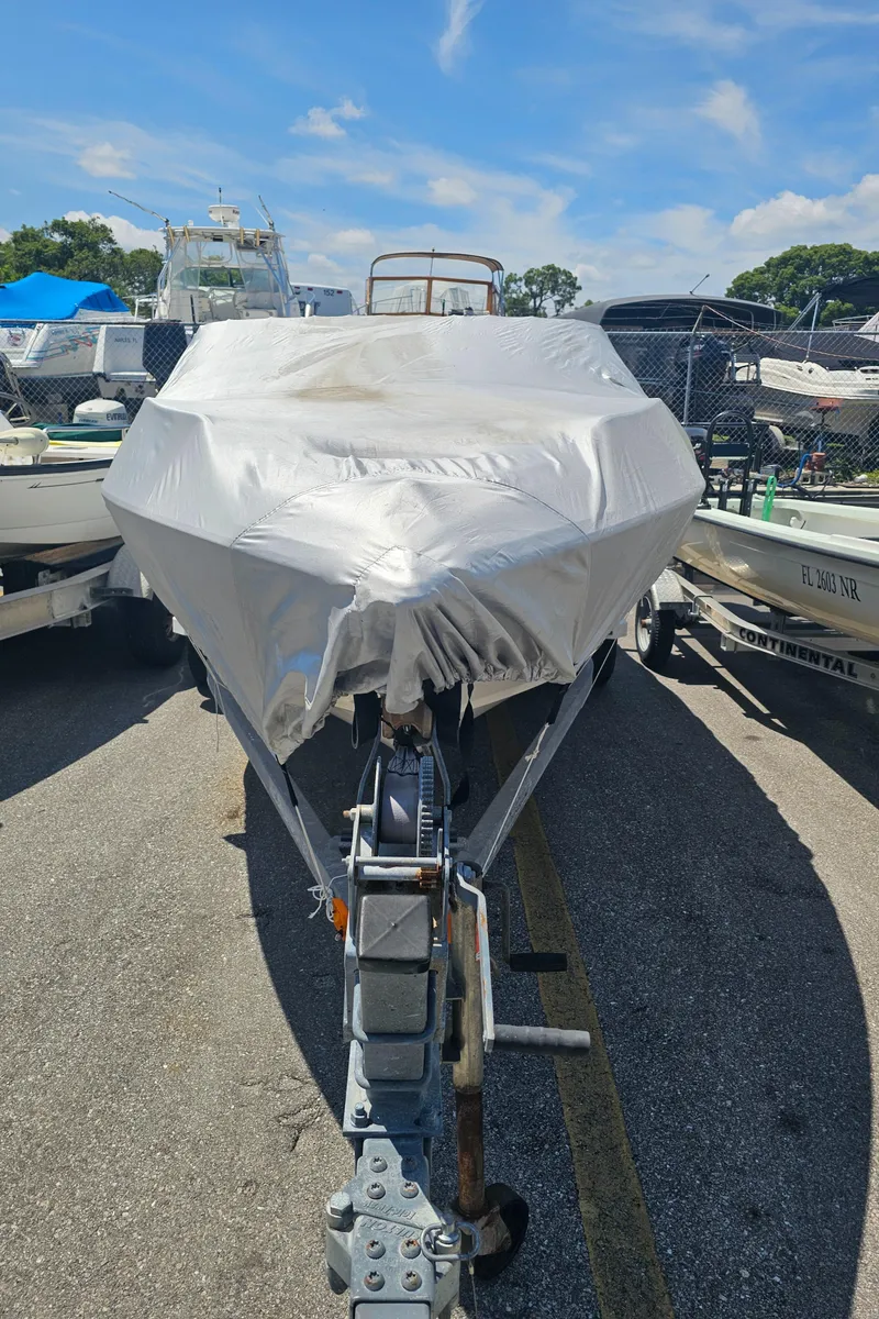 Slide: The Image of 2008 Stingray 185LS boat covered in protective wrap on a trailer. - 11