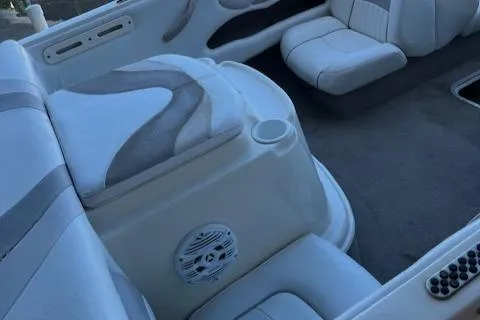 Slide: The Image of 2008 Stingray 185LS boat interior with white and gray seating and speaker. - 7