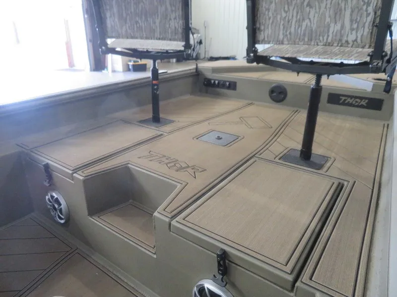 Slide: The Image of 2025 Thor Lake Hammer 1860 Side Console boat interior with seating and storage compartments. - 4