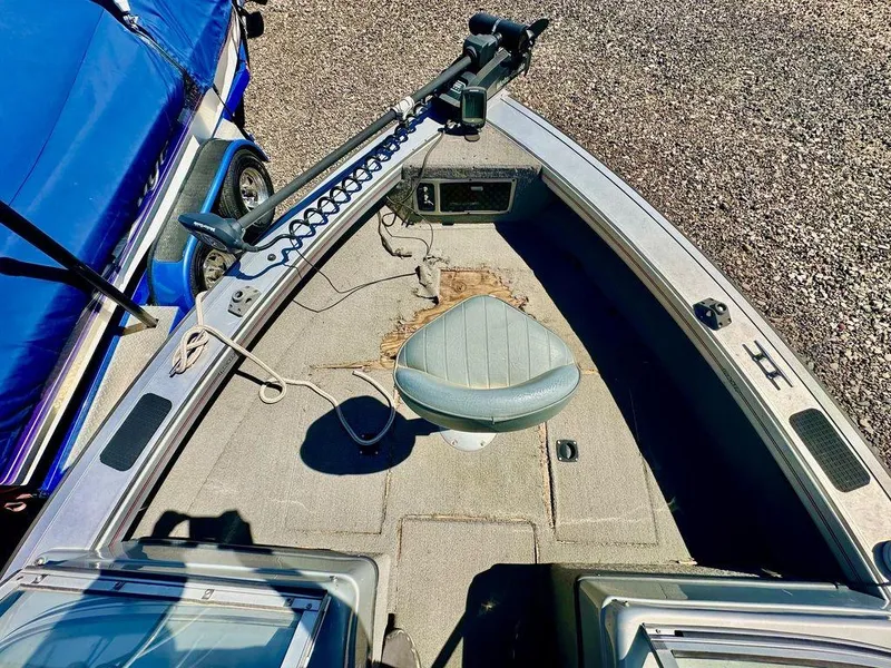 Slide: The Image of 2007 Tracker v175 boat interior with seat and fishing equipment. - 2