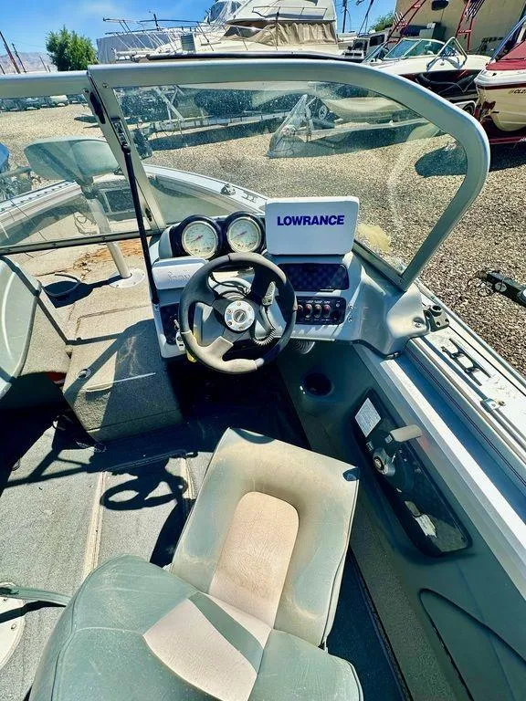 Slide: The Image of 2007 Tracker v175 boat interior with steering wheel and Lowrance navigation system. - 4