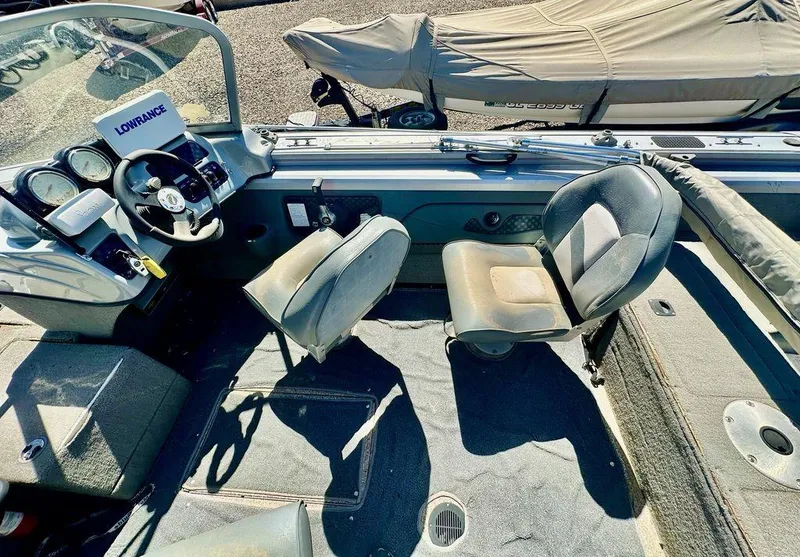 Slide: The Image of 2007 Tracker v175 boat interior with steering wheel and two seats. - 8