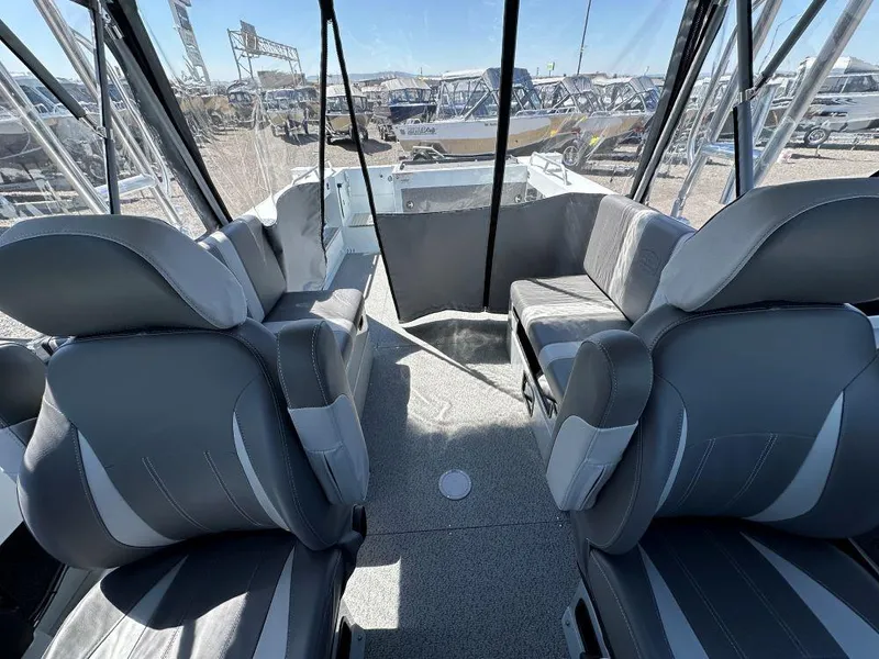 Slide: The Image of 2024 Hewescraft 210 Sea Runner interior with gray seating and spacious layout. - 8