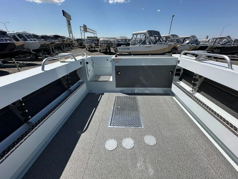 Slide: The Image of 2024 Hewescraft 210 Sea Runner boat interior, spacious deck, and modern design. - 9