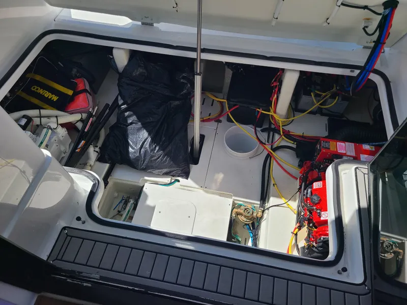 Slide: The Image of 2021 Four Winns Vista 355 Coupe OB engine compartment with wiring and equipment. - 15