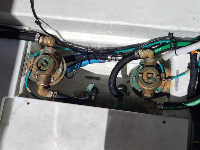 Slide: The Image of Engine compartment of 2021 Four Winns Vista 355 Coupe OB with visible hoses and fittings. - 22