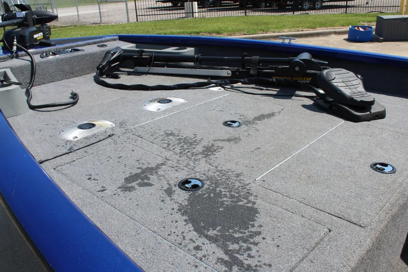 Slide: The Image of 2015 Tracker Pro Team 175 TF boat deck with fishing rod holders and storage compartments. - 14