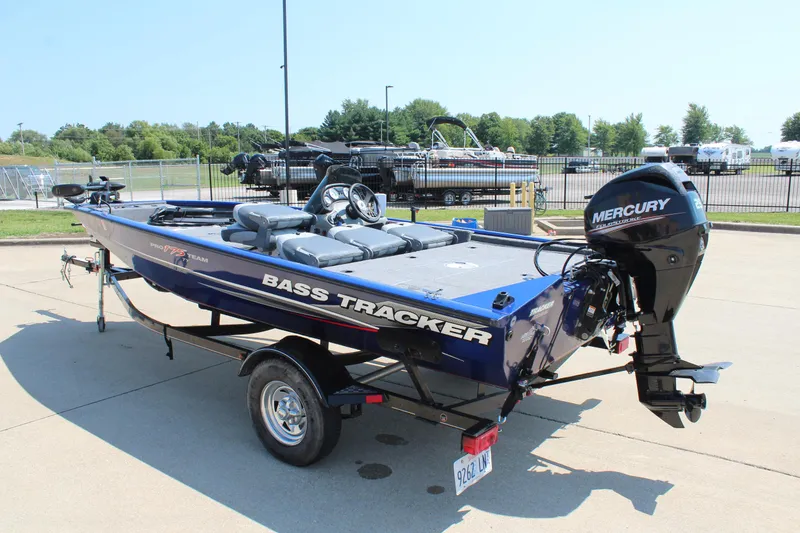 Slide: The Image of 2015 Tracker Pro Team 175 TF bass boat with Mercury engine on trailer. - 5
