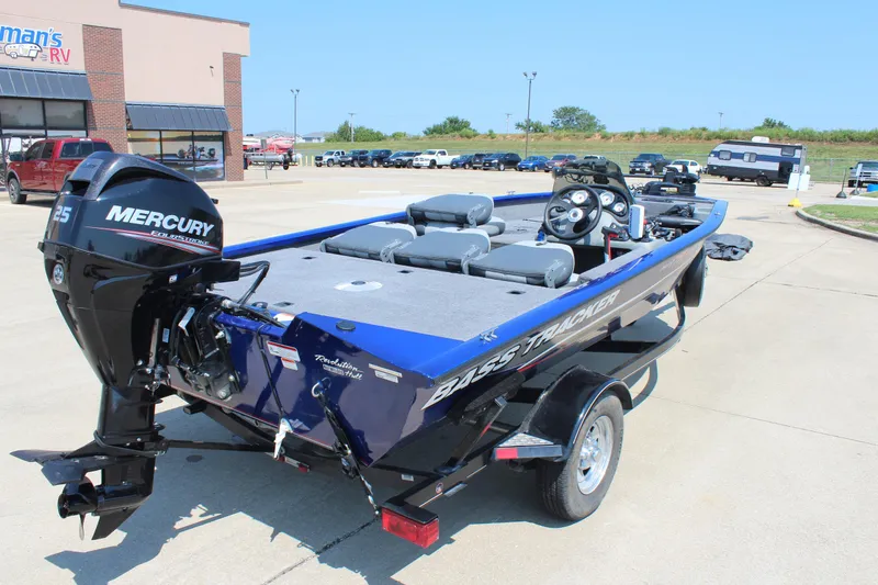 Slide: The Image of 2015 Tracker Pro Team 175 TF boat with Mercury engine in parking lot. - 6