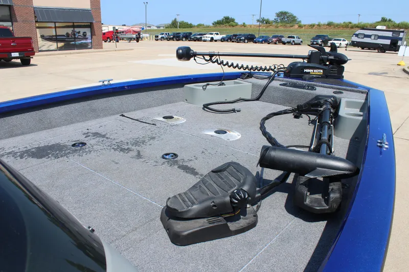 Slide: The Image of 2015 Tracker Pro Team 175 TF boat deck with trolling motor in parking lot. - 7