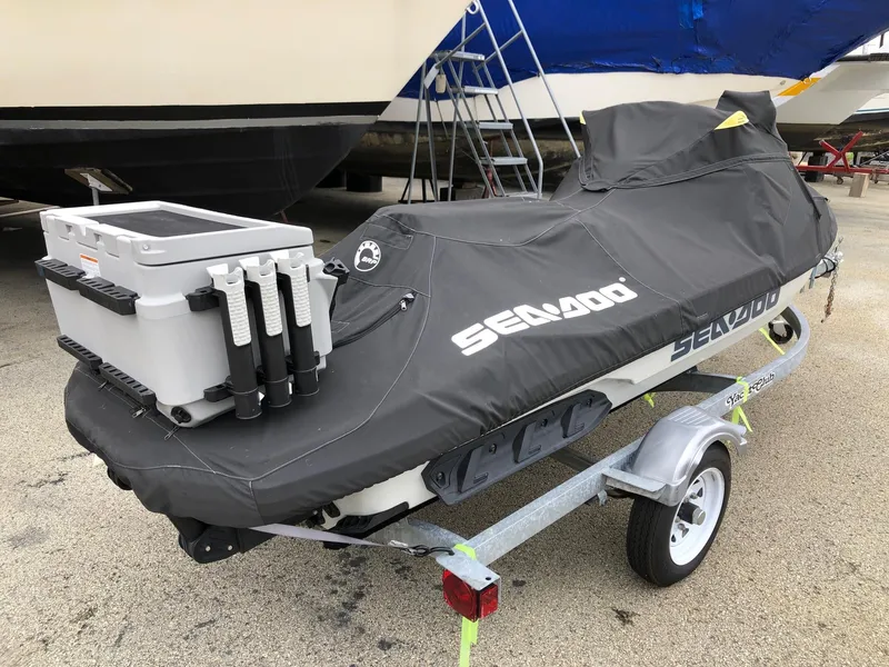 Slide: The Image of 2021 Sea-Doo FISH PRO 170 on trailer, covered, with fishing gear. - 3