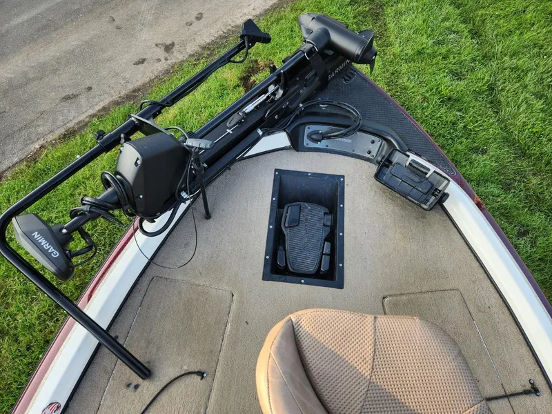 Slide: The Image of 2001 Nitro 896 DC boat deck with trolling motor and pedal controls. - 12